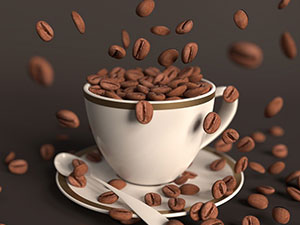 white coffee cup with coffee beans falling into it