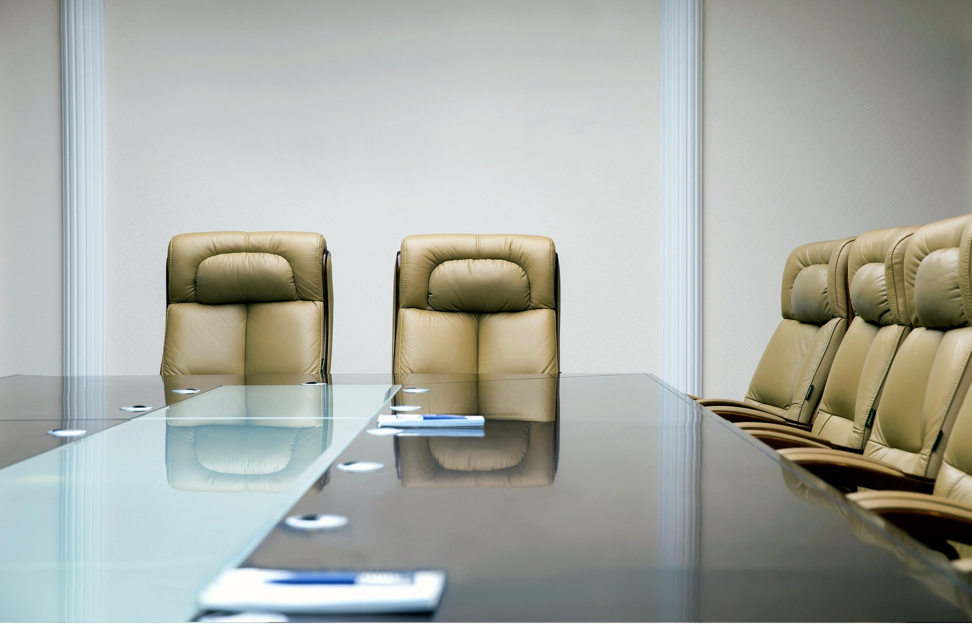 Conference room with leather chairs and glass table